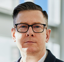 Portrettfoto av Alexander Hughes, leder og administrerende direktør ved kryptohandelsselskap